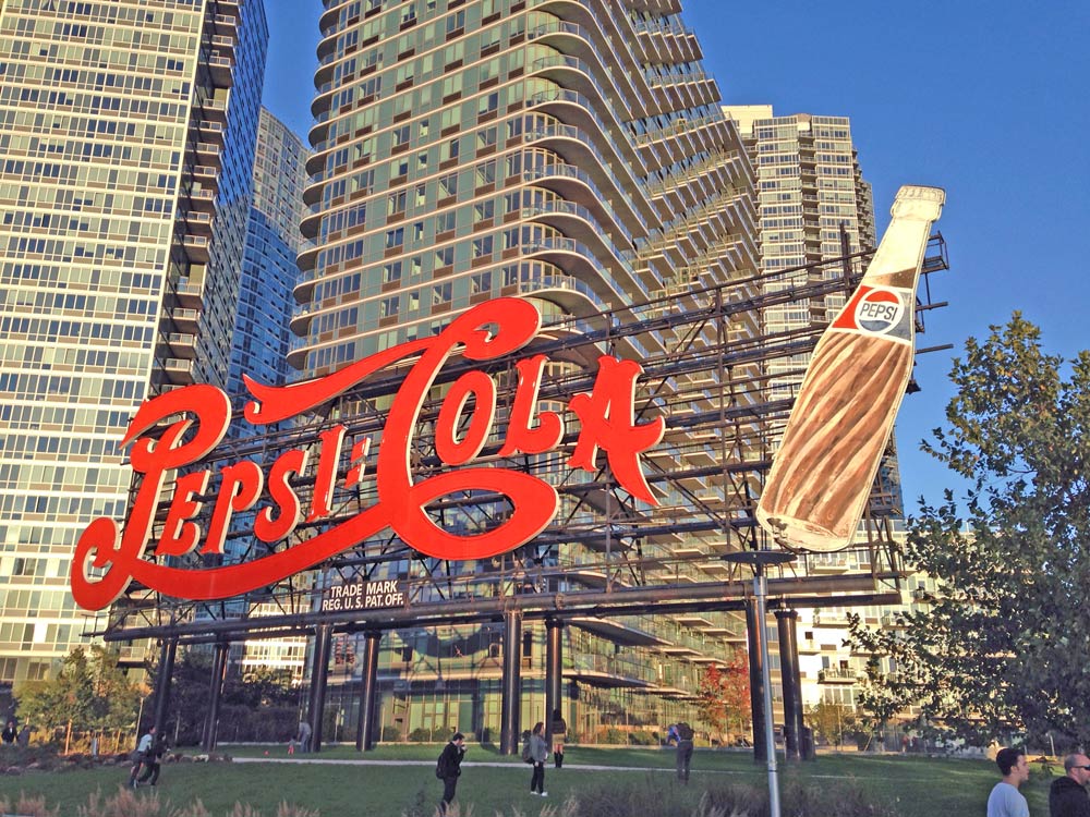 view of large Pepsi Cola sign