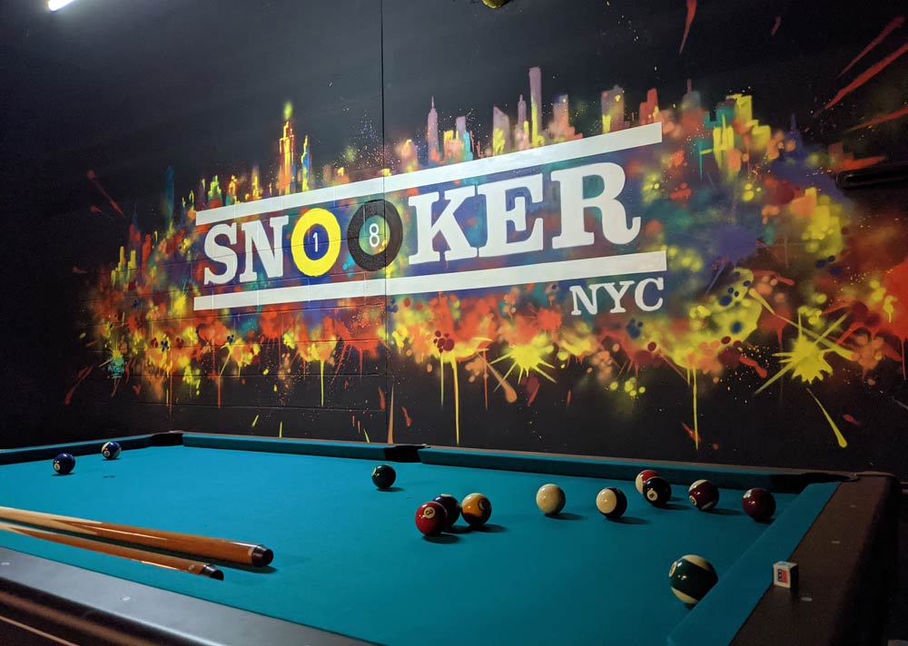Mural logo on a snooker hall wall
