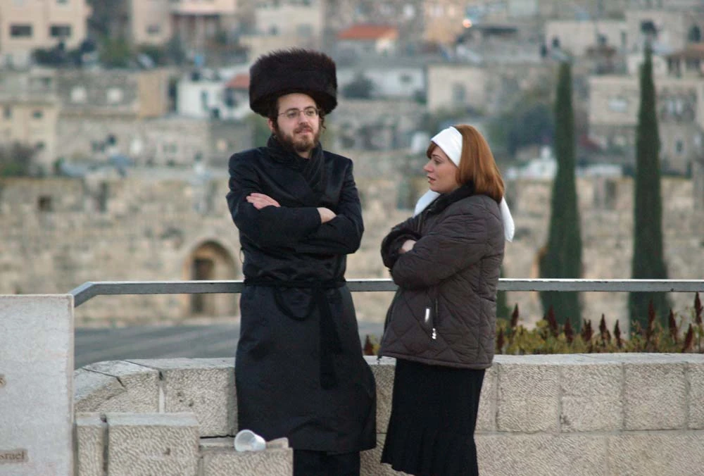 Man and woman standing in city